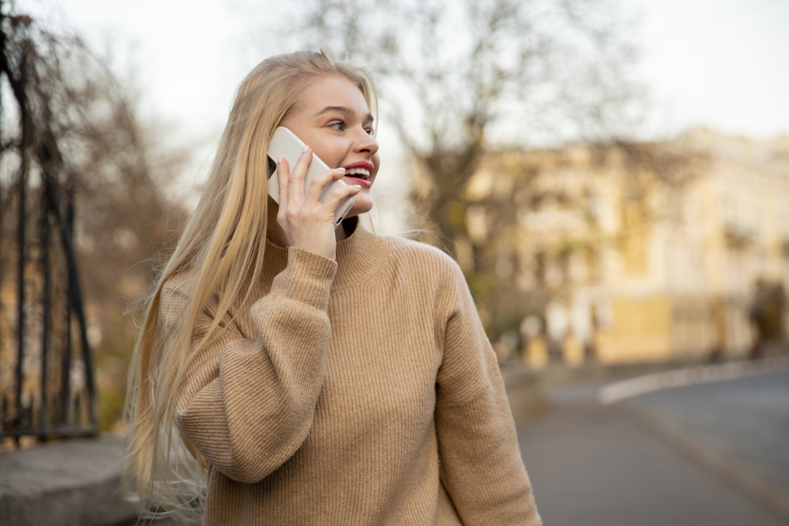 medium shot smiley woman talking phone scaled В Мордовии заработали сервисы VoLTE и VoWiFi от билайна