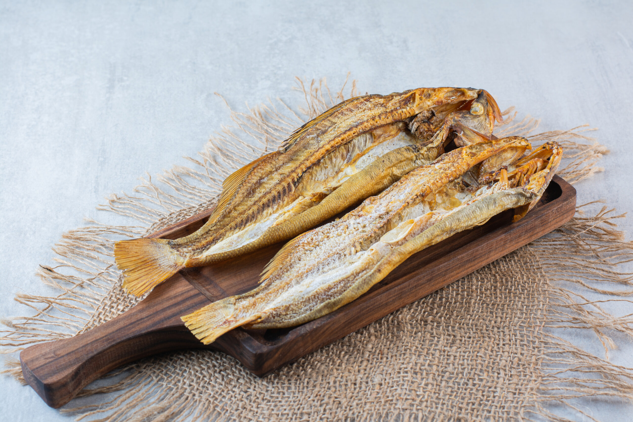 salty dried fish isolated wooden board scaled В Мордовии двое жителей поели вяленой рыбы и заразились опасной инфекцией