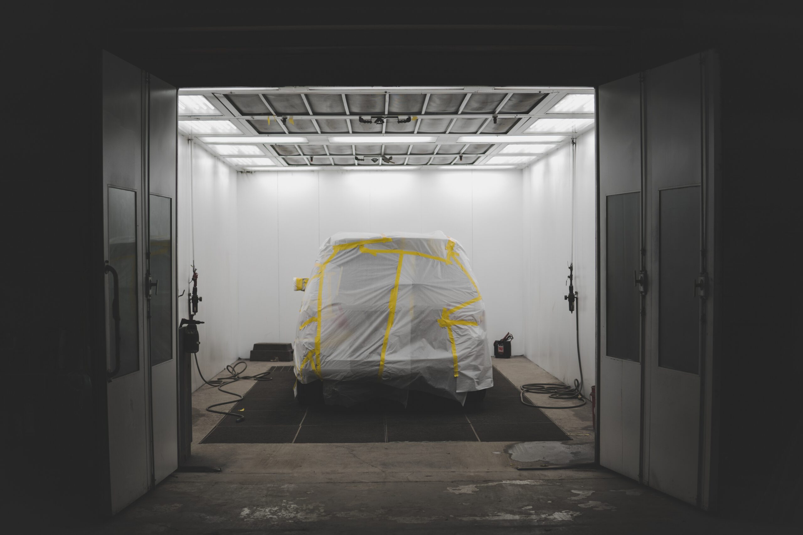 vehicle covered with white sheet yellow tape car service garage scaled В Мордовии запретили строить гаражи выше 3 метров