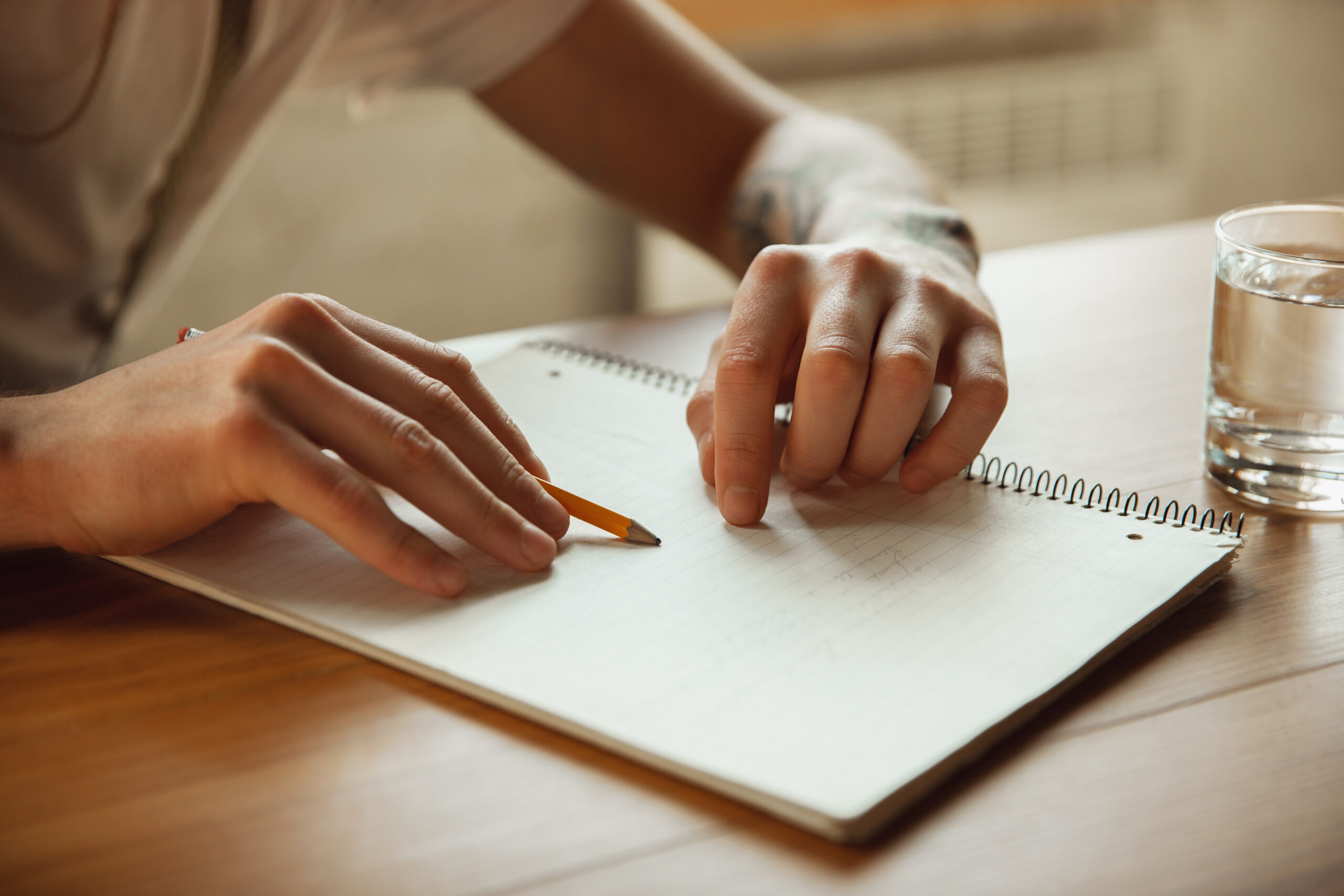 close up male hands writing empty paper table home making notes workhome report his work education freelance art business concept leaves signature doing paperwork scaled Большой этнографический диктант прошел в Мордовии