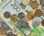 money coins banknotes russian rubles scattered heap table top view idea background banner market news 1 Названа огромная сумма наличных в триллионах рублей, которые россияне хранят «под матрасом»